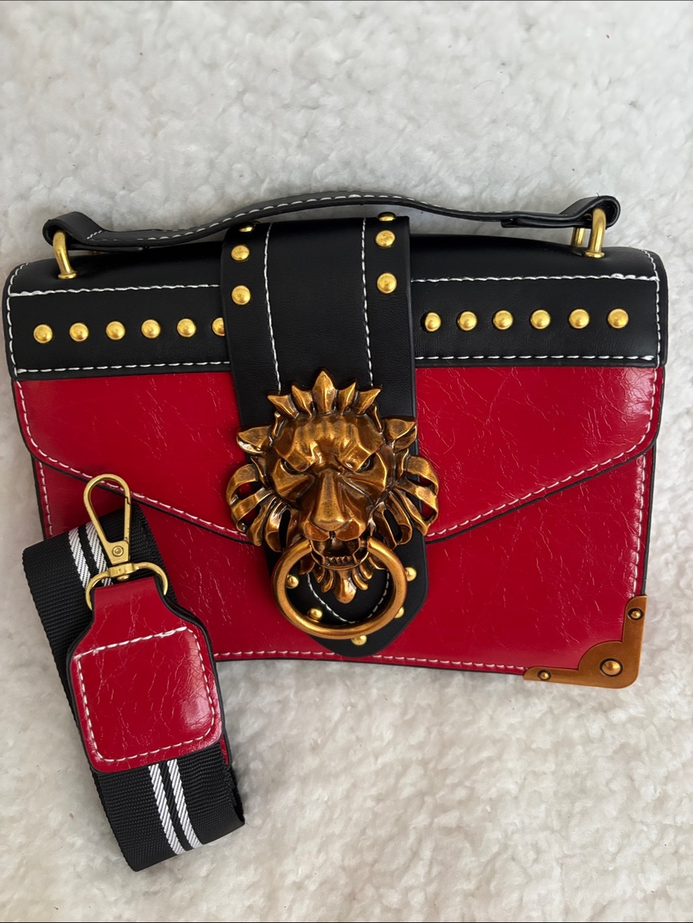 Lion-Embellished Red & Black Crossbody Bag with Copper/Gold Hardware